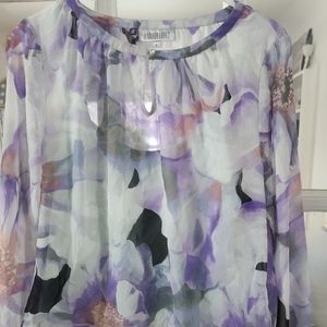 Jennifer Lopez sheer floral blouse.